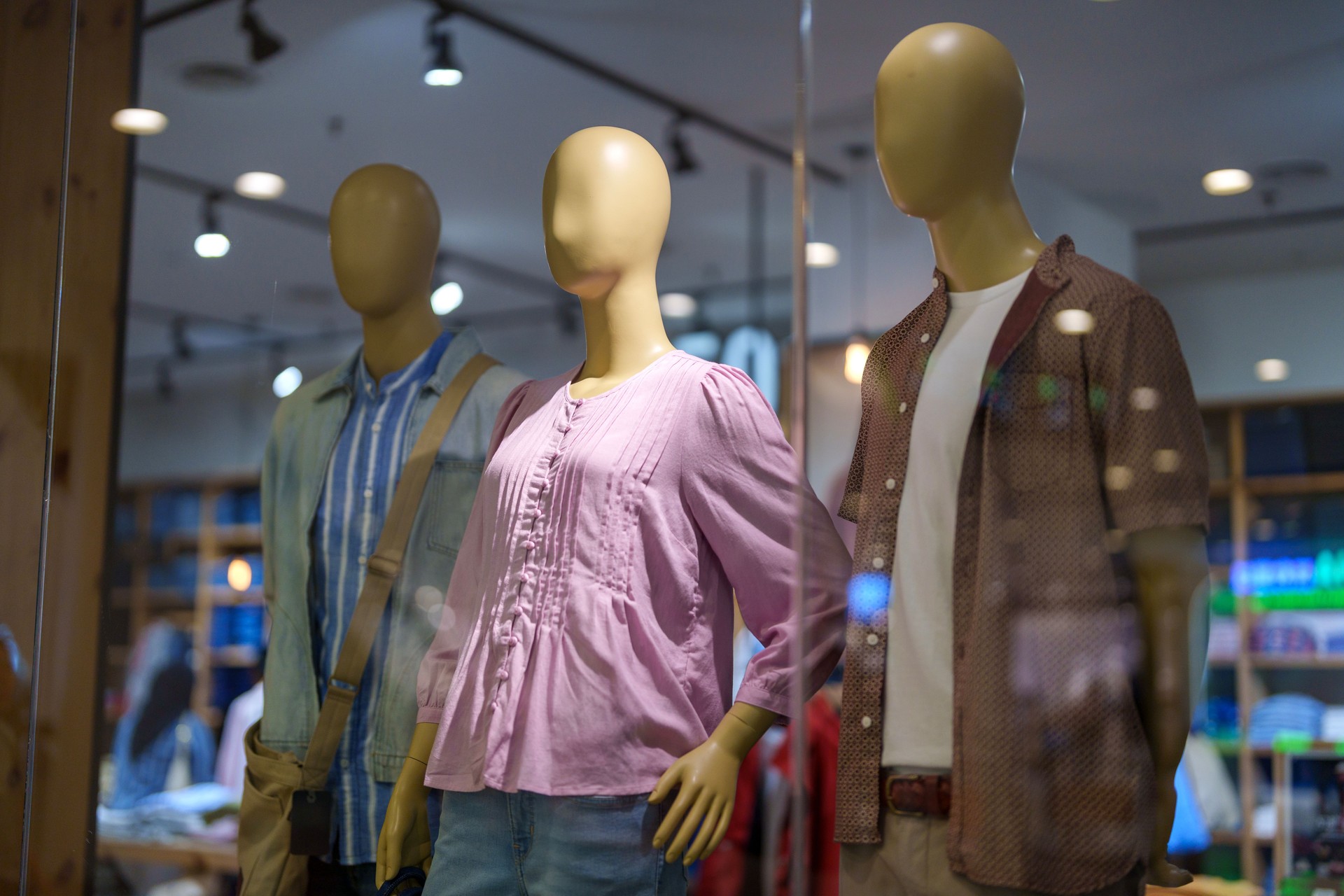 Fashion Mannequins Displaying Casual Clothing in Store Window